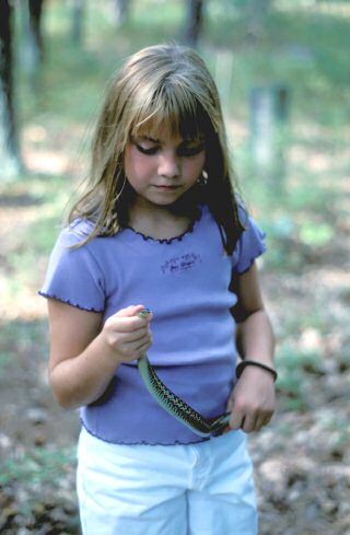 Young naturalist learns about snakes at Parvin State Park